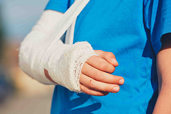 Broken hand of the little boy injured after accident